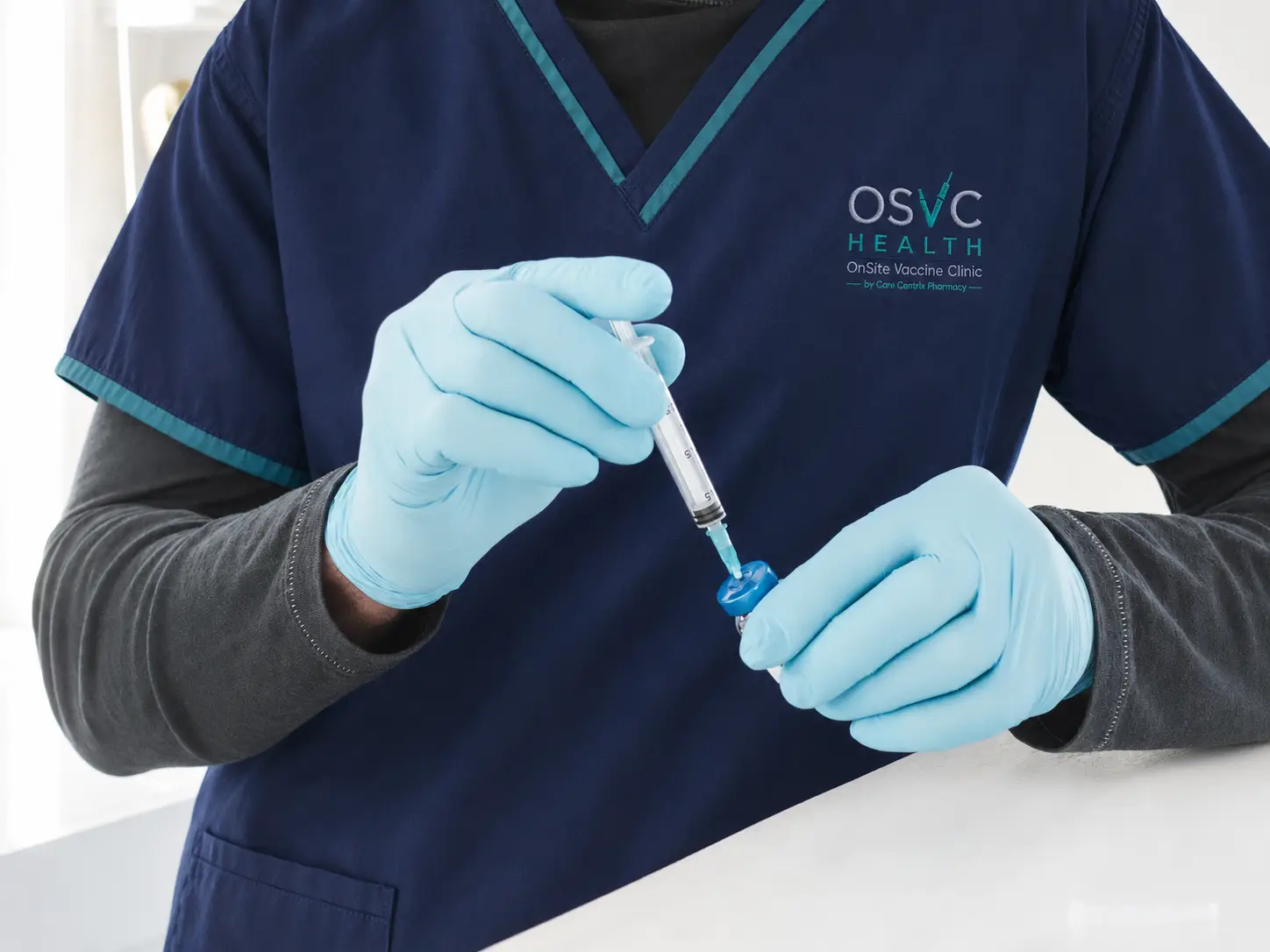 osvc employee with syringe